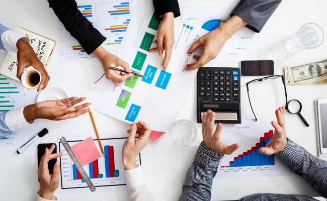 businessmen-hands-white-table-with-documents-drafts-scaled.jpg